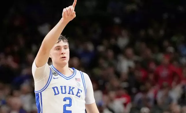 FILE - Duke forward Cooper Flagg celebrates after scoring against the Houston during the second half in the national semifinals at the Final Four of the NCAA college basketball tournament, Saturday, April 5, 2025, in San Antonio. (AP Photo/Brynn Anderson, File)
