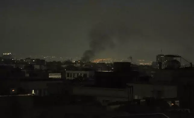 Smoke rises up to the sky, in Tehran, Iran, Friday, June 13, 2025. (AP Photo/Vahid Salemi)