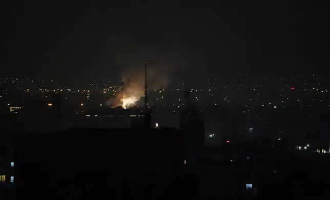 Smoke rises up after an explosion in Tehran, Iran, Friday, June 13, 2025. (AP Photo/Vahid Salemi)