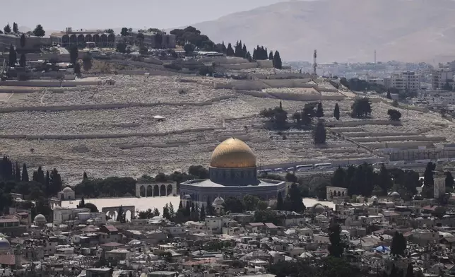 A view of Jerusalem's Old City, with the Dome of the Rock shrine in the Al-Aqsa Mosque compound, closed to worshippers after Israel's Homefront Command banned public gatherings following an Israeli military strike on Iran, Friday, June 13, 2025. (AP Photo/Ohad Zwigenberg)