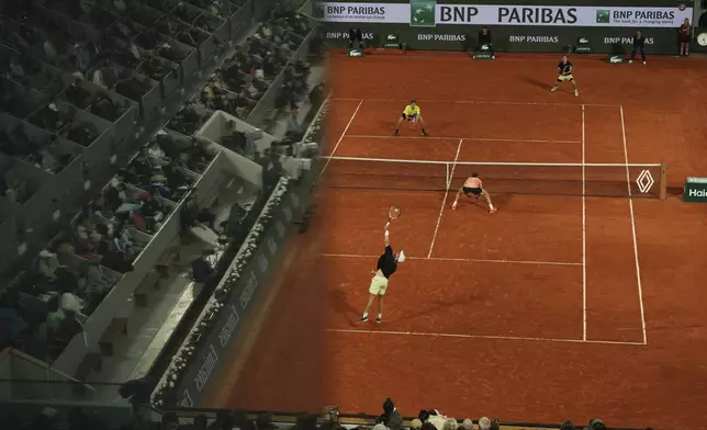 Spain's Marcel Granollers and Argentina's Horacio Zeballos, bottom, play against Britain's Joe Salisbury and Neal Skupski during their men's doubles final match of the French Tennis Open at the Roland-Garros stadium in Paris, Saturday, June 7, 2025. (AP Photo/Aurelien Morissard)