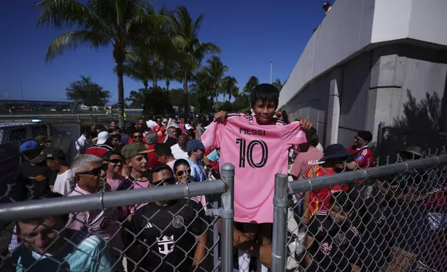 Bernardo Gasca, 10, holds an Inter Miami's Lionel Messi jersey before entering Hard Rock Stadium for the Club World Cup group A soccer match between Al Ahly and Inter Miami in Miami, Fla., Saturday, June 14, 2025. (AP Photo/Rebecca Blackwell)