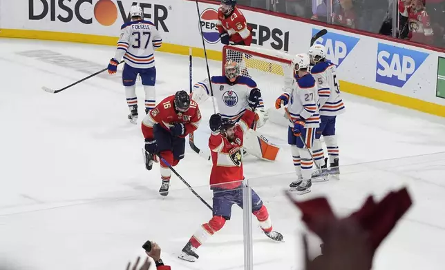 FILE - Florida Panthers players celebrate a goal by Sam Reinhart, not shown, during the second period of Game 7 of the NHL hockey Stanley Cup Final against the Edmonton Oilers, Monday, June 24, 2024, in Sunrise, Fla. (AP Photo/Rebecca Blackwell, File)