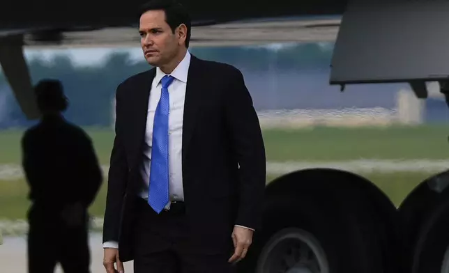 Secretary of State Marco Rubio arrives with President Donald Trump on Air Force One, Wednesday, June 25, 2025, at Joint Base Andrews, Md. (AP Photo/Julia Demaree Nikhinson)