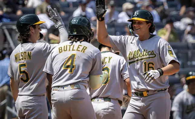 The Athletics celebrate Nick Kurtz' (16) three run home run during the sixth inning of a baseball game against the New York Yankees, Saturday, June 28, 2025, in New York. (AP Photo/Angelina Katsanis)