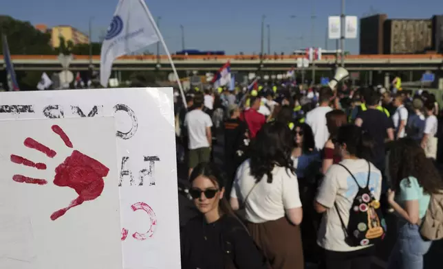 People block a highway during a protest, seven months after a deadly train station tragedy that sparked mass demonstrations against corruption, in Belgrade, Serbia, Sunday, June 1, 2025. (AP Photo/Darko Vojinovic)