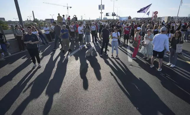 People block a highway during a protest seven months after the deadly train station tragedy that sparked mass demonstrations against corruption in Belgrade, Serbia, Sunday, June 1, 2025. (AP Photo/Darko Vojinovic)