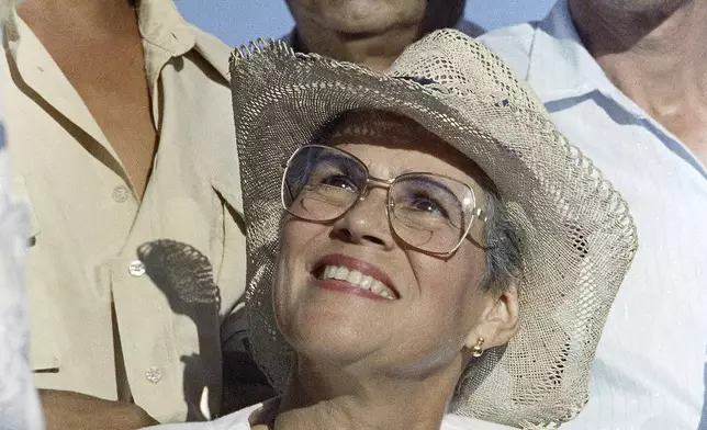 FILE - Presidential candidate Violeta Barrios de Chamorro smiles during a campaign rally in Managua, Feb. 23, 1990. Barrios de Chamorro, a simple housewife thrust into Nicaraguan politics by the assassination of her husband and who, as president, ended a civil war, died on Saturday, June 14, 2025, in San José, Costa Rica, her family said in a statement. She was 95. (AP Photo/John Hopper, File)