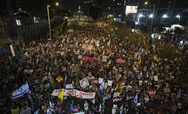 People take part in a protest demanding the end of the war and immediate release of hostages held by Hamas in the Gaza Strip, and against Prime Minister Benjamin Netanyahu's government in Tel Aviv, Israel, Saturday, June 7, 2025. (AP Photo/Ohad Zwigenberg)