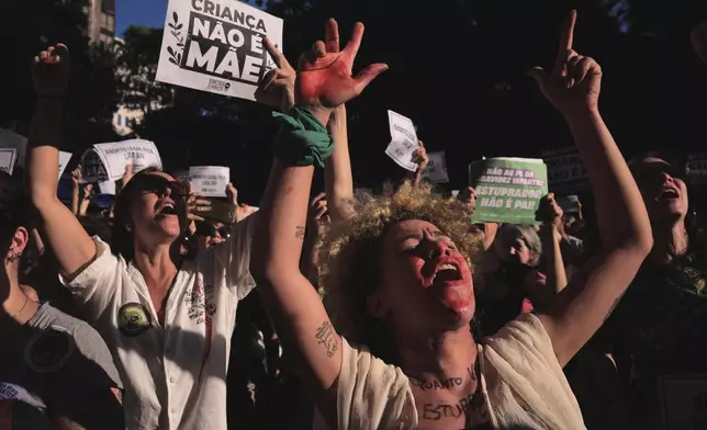 FILE - Abortion rights activists march in a ‘A Child Is Not a Mother’ rally against an anti-abortion congressional bill, along Paulista Avenue in Sao Paulo, June 15, 2024. (AP Photo/Ettore Chiereguini, File)