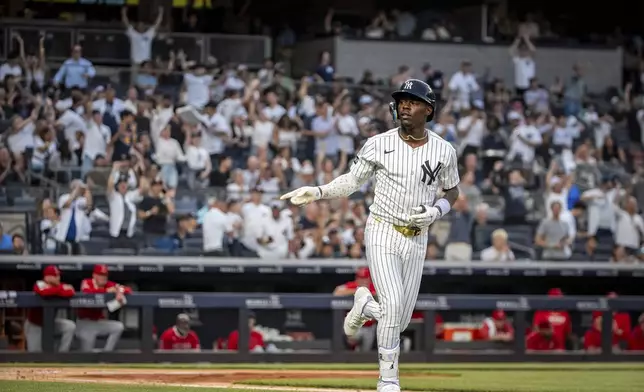 New York Yankees' Jazz Chisholm Jr. (13) celebrates a home run during the second inning of a baseball game against the Los Angeles Angels, Wednesday, June 18, 2025, in New York. (AP Photo/Angelina Katsanis)