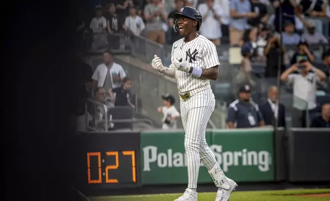 New York Yankees' Jazz Chisholm Jr. (13) celebrates a home run during the second inning of a baseball game against the Los Angeles Angels, Wednesday, June 18, 2025, in New York. (AP Photo/Angelina Katsanis)