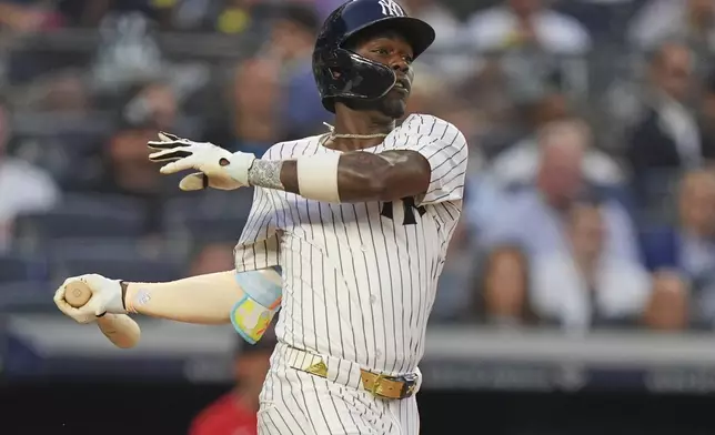 New York Yankees' Jazz Chisholm Jr. hits an RBI single during the second inning of a baseball game against the Boston Red Sox, Friday, June 6, 2025, in New York. (AP Photo/Frank Franklin II)