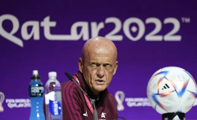 FILE - Chairman of the FIFA referees committee Pierluigi Collina reacts at a press conference of the FIFA referees at the World Cup media center in Doha, Qatar, Friday, Nov. 18, 2022.(AP Photo/Martin Meissner, file)