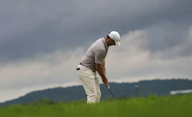 Rory McIlroy, of Northern Ireland, putts on the ninth hole during the third round of the U.S. Open golf tournament at Oakmont Country Club Saturday, June 14, 2025, in Oakmont, Pa. (AP Photo/Charlie Riedel)
