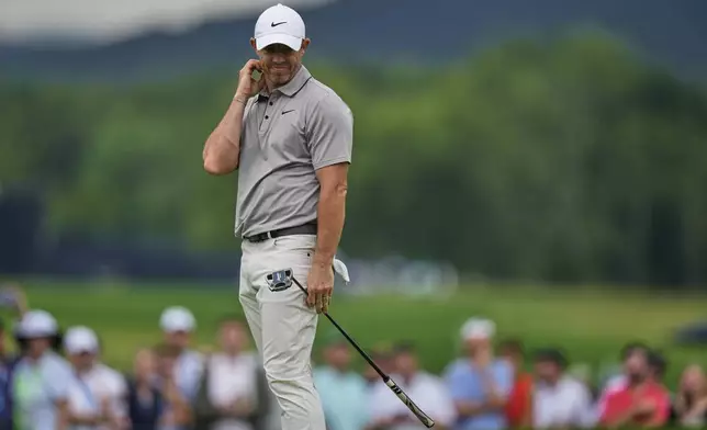 Rory McIlroy, of Northern Ireland, reacts after missing a putt on the ninth hole during the third round of the U.S. Open golf tournament at Oakmont Country Club Saturday, June 14, 2025, in Oakmont, Pa. (AP Photo/Charlie Riedel)
