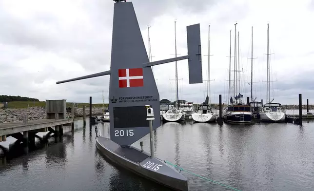 A Saildrone "Voyager", uncrewed surface vehicle (USV), is moored at the Koge Marina in Koge, eastern Denmark, Monday, June 16, 2025. (AP Photo/James Brooks)