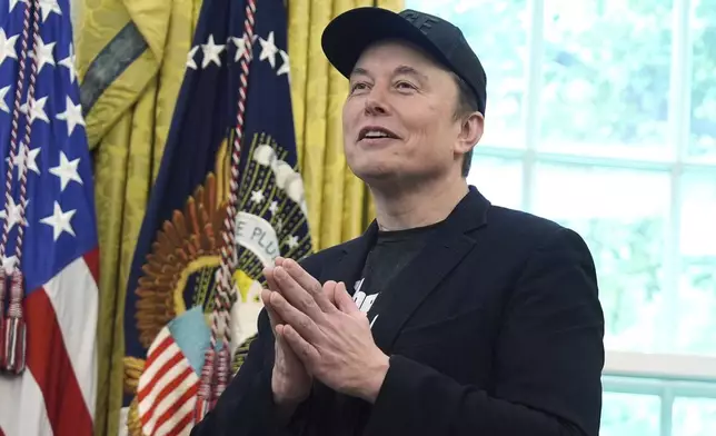 Elon Musk gestures as he speaks during a news conference with President Donald Trump in the Oval Office of the White House, Friday, May 30, 2025, in Washington. (AP Photo/Evan Vucci)