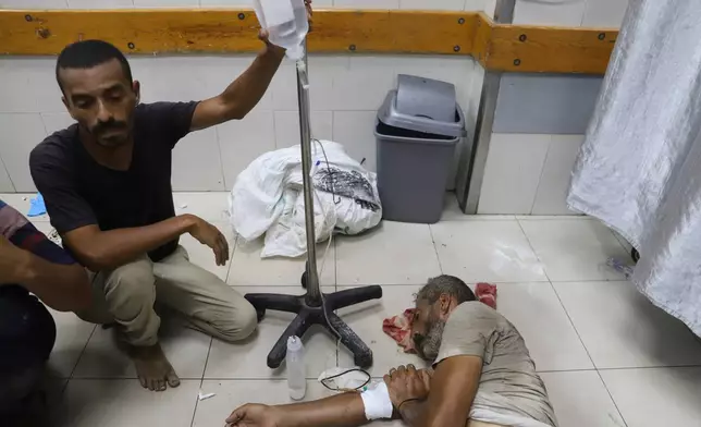 A Palestinian wounded while returning from one of the Gaza Humanitarian Foundation distribution centers operated by the U.S.-backed organization, according to Nasser Hospital, are treated in Khan Younis, Monday, June 30, 2025. (AP Photo/Mariam Dagga)