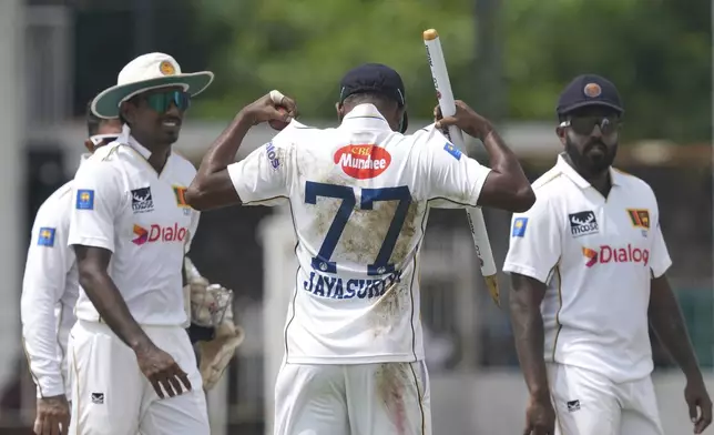 Sri Lanka's Prabath Jayasuriya acknowledges after taking five Bangladeshi wickets during the fourth day of the second cricket test match between Sri Lanka and Bangladesh in Colombo, Sri Lanka, Saturday, June 28, 2025. (AP Photo/Eranga Jayawardena)