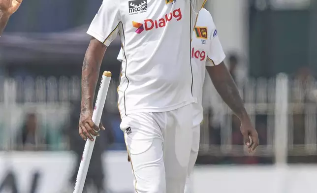 Sri Lanka's Prabath Jayasuriya acknowledges after taking five Bangladeshi wickets during the fourth day of the second cricket test match between Sri Lanka and Bangladesh in Colombo, Sri Lanka, Saturday, June 28, 2025. (AP Photo/Eranga Jayawardena)