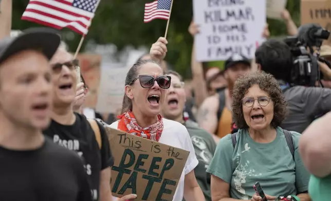 Protesters gather outside the Federal Courthouse before arguments whether Kilmar Abrego Garcia can be released from jail on Friday, June 13, 2025 in Nashville, Tenn. (AP Photo/George Walker IV)