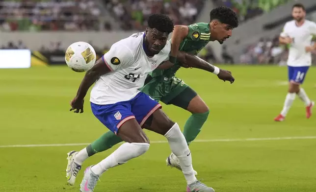 United States' Patrick Agyemang, left, and Saudi Arabia's Ziyad Aljohani, right, battle for control of the ball during a CONCACAF Gold Cup soccer match, Thursday, June 19, 2025, in Austin, Texas. (AP Photo/Eric Gay)