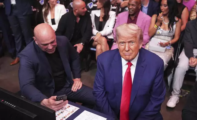President Donald Trump attends the UFC-316 mixed martial arts event, at the Prudential Center, Saturday, June 7, 2025, in Newark, N.J., with UFC's Dana White, left. (AP Photo/Frank Franklin II)