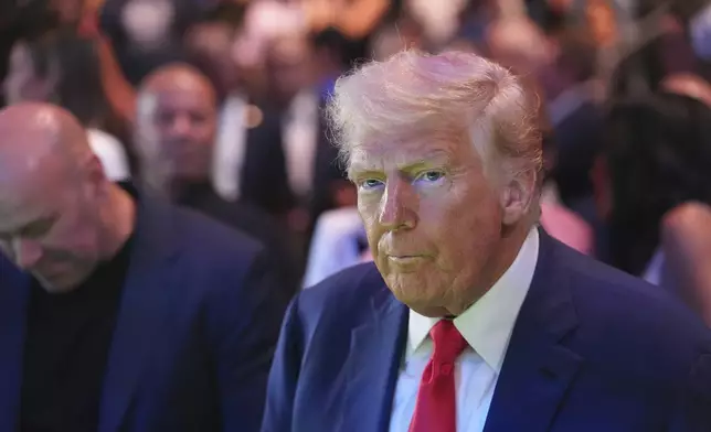 President Donald Trump attends the UFC-316 mixed martial arts event, at the Prudential Center, Saturday, June 7, 2025, in Newark, N.J., with UFC's Dana White, left. (AP Photo/Frank Franklin II)
