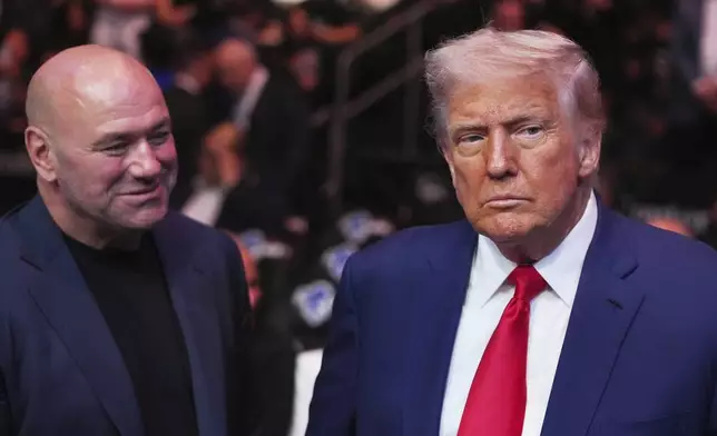 President Donald Trump attends the UFC-316 mixed martial arts event, at the Prudential Center, Saturday, June 7, 2025, in Newark, N.J., as UFC's Dana White, looks on. (AP Photo/Frank Franklin II)
