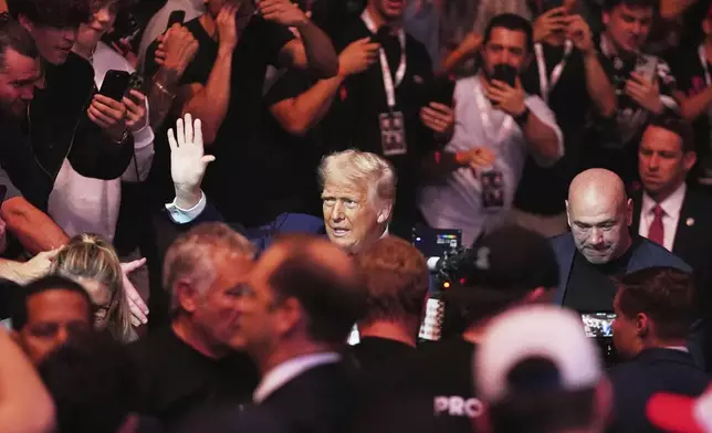 President Donald Trump attends the UFC-316 mixed martial arts event, at the Prudential Center, Saturday, June 7, 2025, in Newark, N.J., withUFC's Dana White, right. (AP Photo/Frank Franklin II)