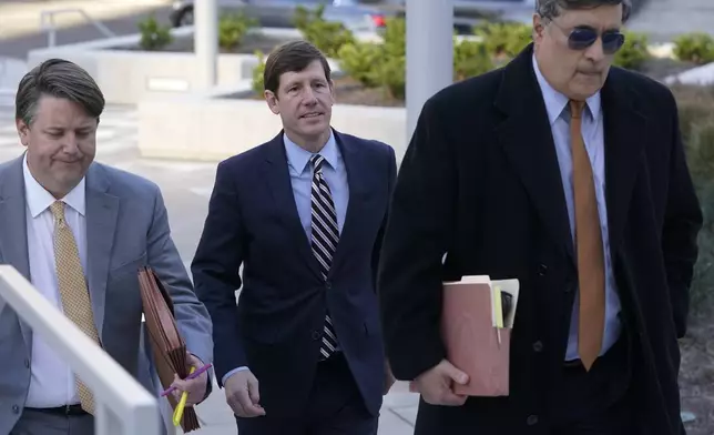 FILE - Former Republican state Sen. Brian Kelsey, center, arrives at federal court, Nov. 22, 2022, in Nashville, Tenn. (AP Photo/Mark Humphrey, File)
