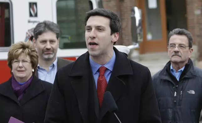FILE - Cincinnati City Councilman P.G. Sittenfeld, center, speaks during a news conference in Cincinnati on Feb. 19, 2013. (AP Photo/Al Behrman, File)