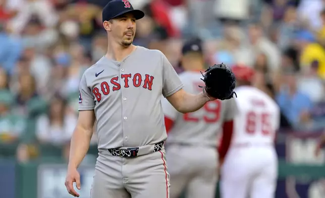 Boston Red Sox starting pitcher Walker Buehler reacts after giving up a solo home run to Los Angeles Angels' Zach Neto on the first pitch of a baseball game during the first inning, Monday, June 23, 2025, in Anaheim, Calif. (AP Photo/Jayne Kamin-Oncea)