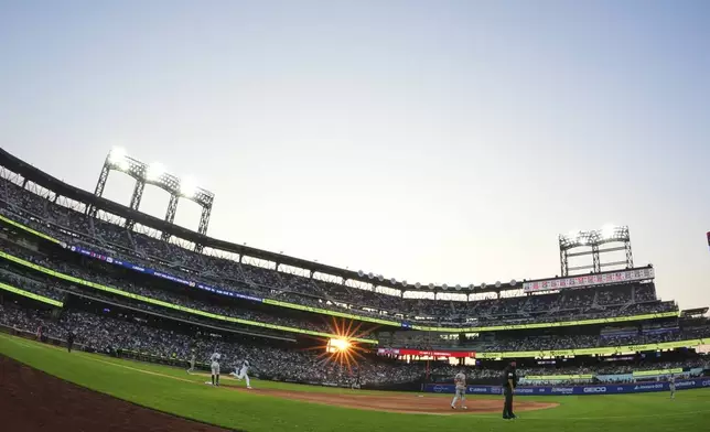 New York Mets' Francisco Lindor turns toward second base for a double during the third inning of a baseball game against the Washington Nationals Wednesday, June 11, 2025, in New York. (AP Photo/Frank Franklin II)