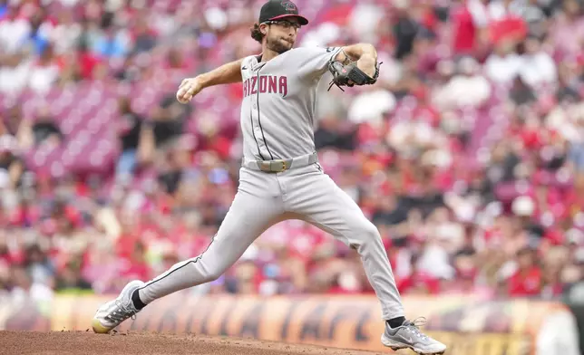Arizona Diamondbacks pitcher Zac Gallen throws during the first inning of a baseball game against the Cincinnati Reds, Sunday, June 8, 2025, in Cincinnati. (AP Photo/Jeff Dean)
