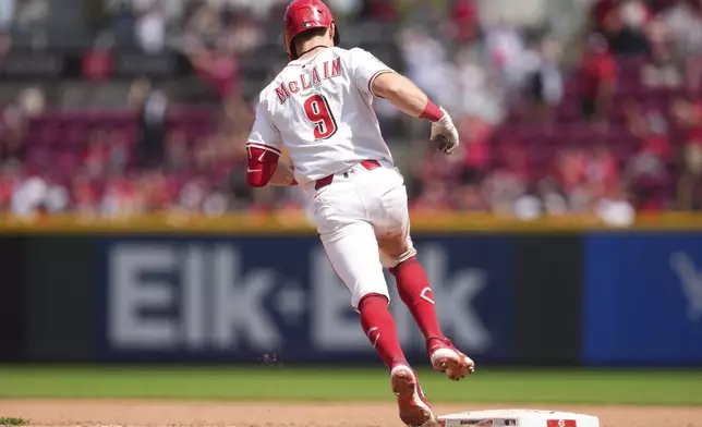 Cincinnati Reds' Matt McLain rounds the bases after hitting a two-run home run during the seventh inning of a baseball game against the Arizona Diamondbacks, Sunday, June 8, 2025, in Cincinnati. (AP Photo/Jeff Dean)