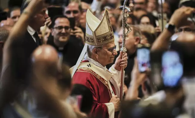Pope Leo XIV arrives in St. Peter's Basilica at the Vatican to celebrate a Mass where he will bless the pallia for the new metropolitan archbishops, Sunday, June 29, 2025. (AP Photo/Andrew Medichini)