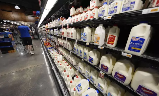 FILE - Dairy products line the cooler at a grocery store in New Orleans, April 17, 2024. (AP Photo/Gerald Herbert, File)