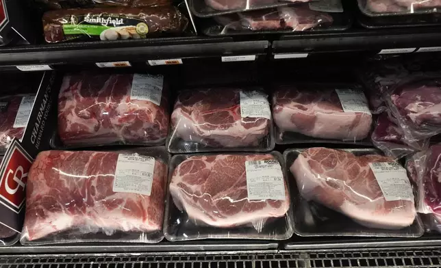 FILE - Pork products line the cooler at a grocery store in New Orleans, April 17, 2024. (AP Photo/Gerald Herbert, File)