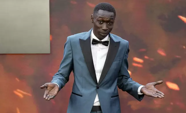 FILE - Khaby Lame poses for photographers upon arrival at the premiere of the film 'Oppenheimer' in London, July 13, 2023. (Scott Garfitt/Invision/AP File)
