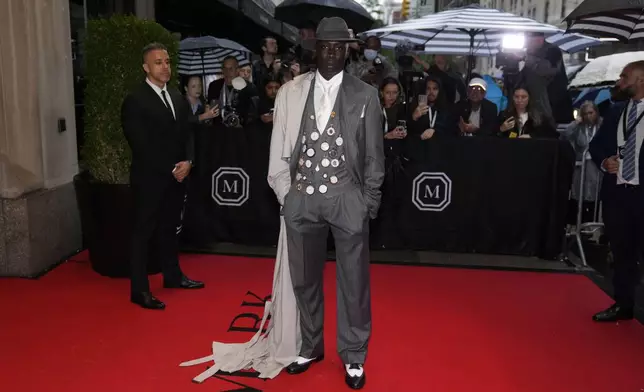 FILE - Khaby Lame departs The Mark Hotel prior to attending The Metropolitan Museum of Art's Costume Institute benefit gala celebrating the opening of "Superfine: Tailoring Black Style" in New York, May 5, 2025. (Photo by Charles Sykes/Invision/AP File)