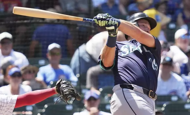 Seattle Mariners' Cal Raleigh hits a single during the fifth inning of a baseball game against the Chicago Cubs in Chicago, Sunday, June 22, 2025. (AP Photo/Nam Y. Huh)