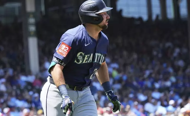 Seattle Mariners' Cal Raleigh watches his two-run home run during the first inning of a baseball game against the Chicago Cubs in Chicago, Sunday, June 22, 2025. (AP Photo/Nam Y. Huh)