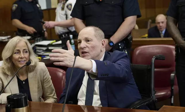 Harvey Weinstein jokes with press photographers in Manhattan criminal court as the jury in his retrial deliberates, Wednesday, June 11, 2025, in New York. Curtis Means/Pool Photo via AP)