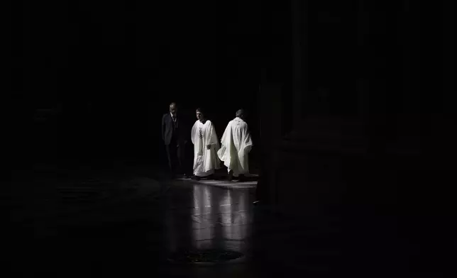 Priests walks inside St. Peter's Basilica during an ordination Mass celebrated by Pope Leo XIV in at the Vatican as part of the Jubilee of Priests, Friday, June 27, 2025. (AP Photo/Alessandra Tarantino)