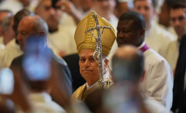 Pope Leo XIV arrives to celebrate an ordination Mass in St. Peter's Basilica at the Vatican as part of the Jubilee of Priests, Friday, June 27, 2025. (AP Photo/Alessandra Tarantino)