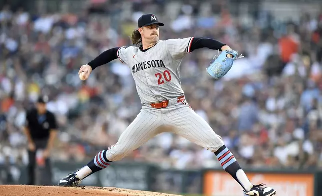 Minnesota Twins starting pitcher Chris Paddack throws during the first inning of a baseball game against the Detroit Tigers, Sunday, June 29, 2025, in Detroit. (AP Photo/Jose Juarez)
