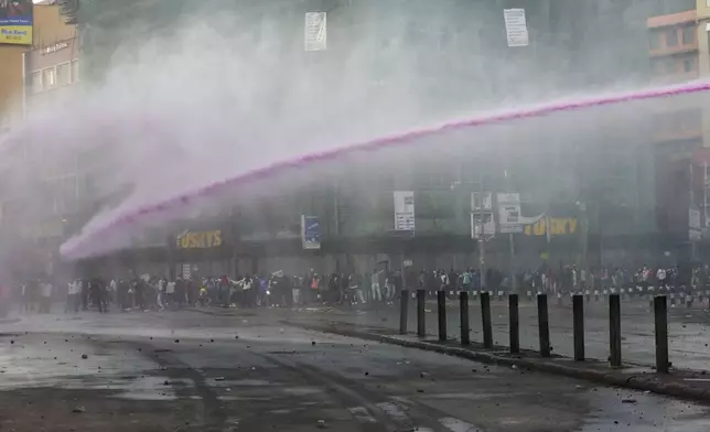 Riot police use water canons to disperse demonstrators during a protest over the death of blogger Albert Ojwang in police custody Thursday June 12, 2025, Nairobi, Kenya. (AP Photo/Andrew Kasuku)