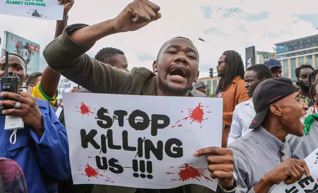 Demonstrators react to the death of Kenyan blogger Albert Ojwang, who died while in police custody in Nairobi, Monday, June 9, 2025. (AP Photo/Andrew Kasuku)